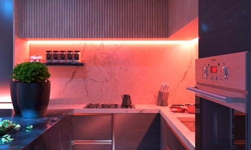 Orange coloured LED strip light under kitchen wall cabinets