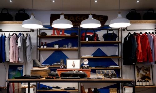 Small business lighting for retail shop illuminating clothing displays
