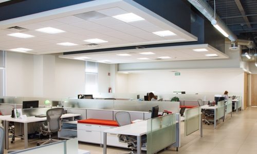 Modern office environment with LED lighting mounted in suspended ceilings