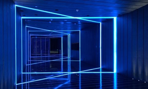 Blue LED lights in a corridor warapping around the floor, walls and ceiling