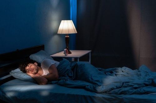 Person Sleeping With The Lamp On